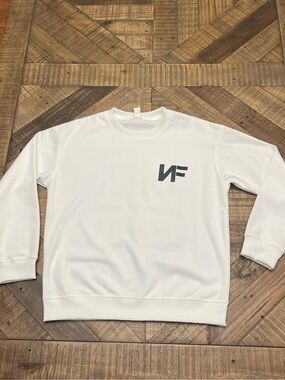 sweatshirt features artwork related to the rapper NF (Nathan Feuerstein)